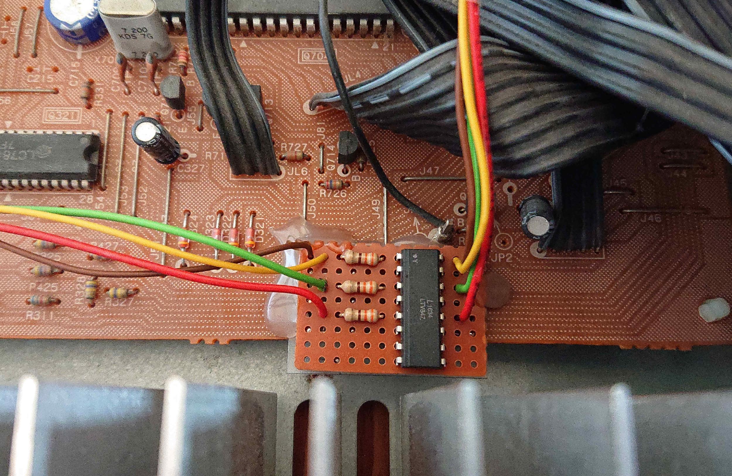 Opto-coupler array in a DIP package on a piece of 
perfboard PCB material along with some resistors