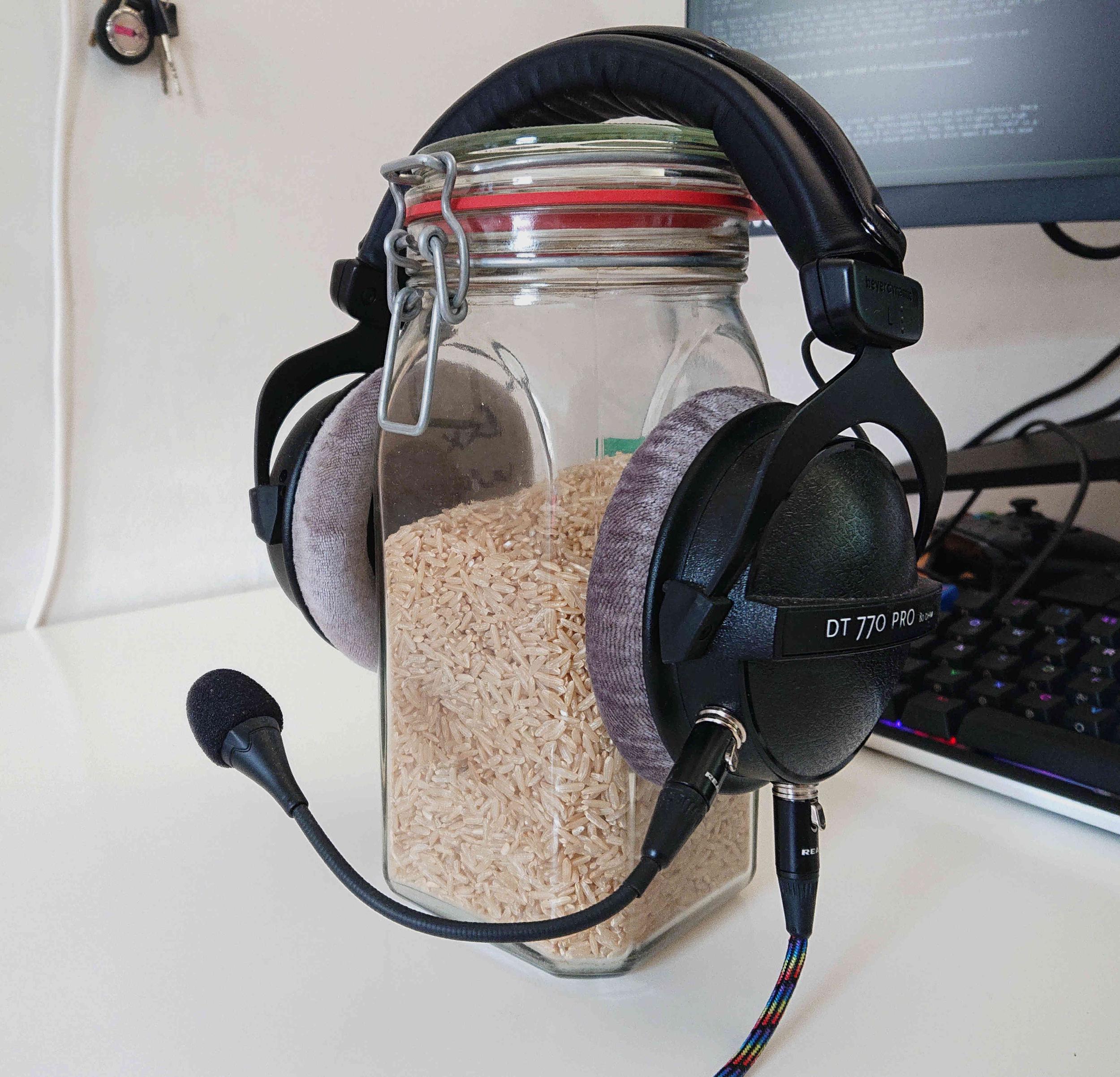 Headset sitting on a jar of natural rice 
used as a head substitute